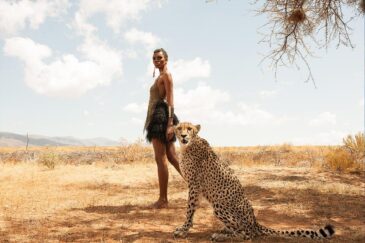 Foto kunst cheetah en mooie afrikaanse vrouw